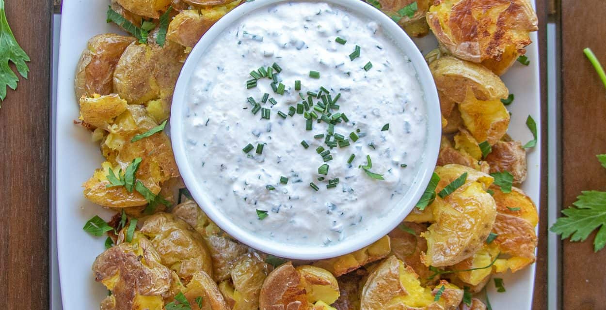 CRISPY SMASHED  POTATOES WITH CHIVE DIP